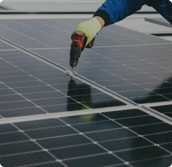 Technician installing solar panels